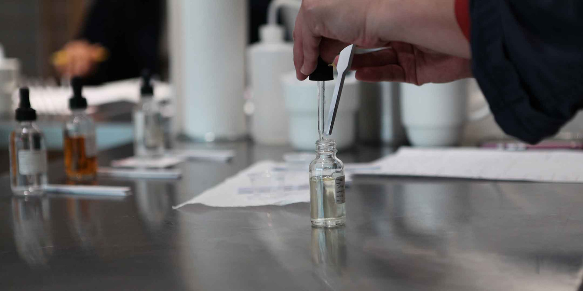 Perfumer blending fragrance in the Oudisan lab
